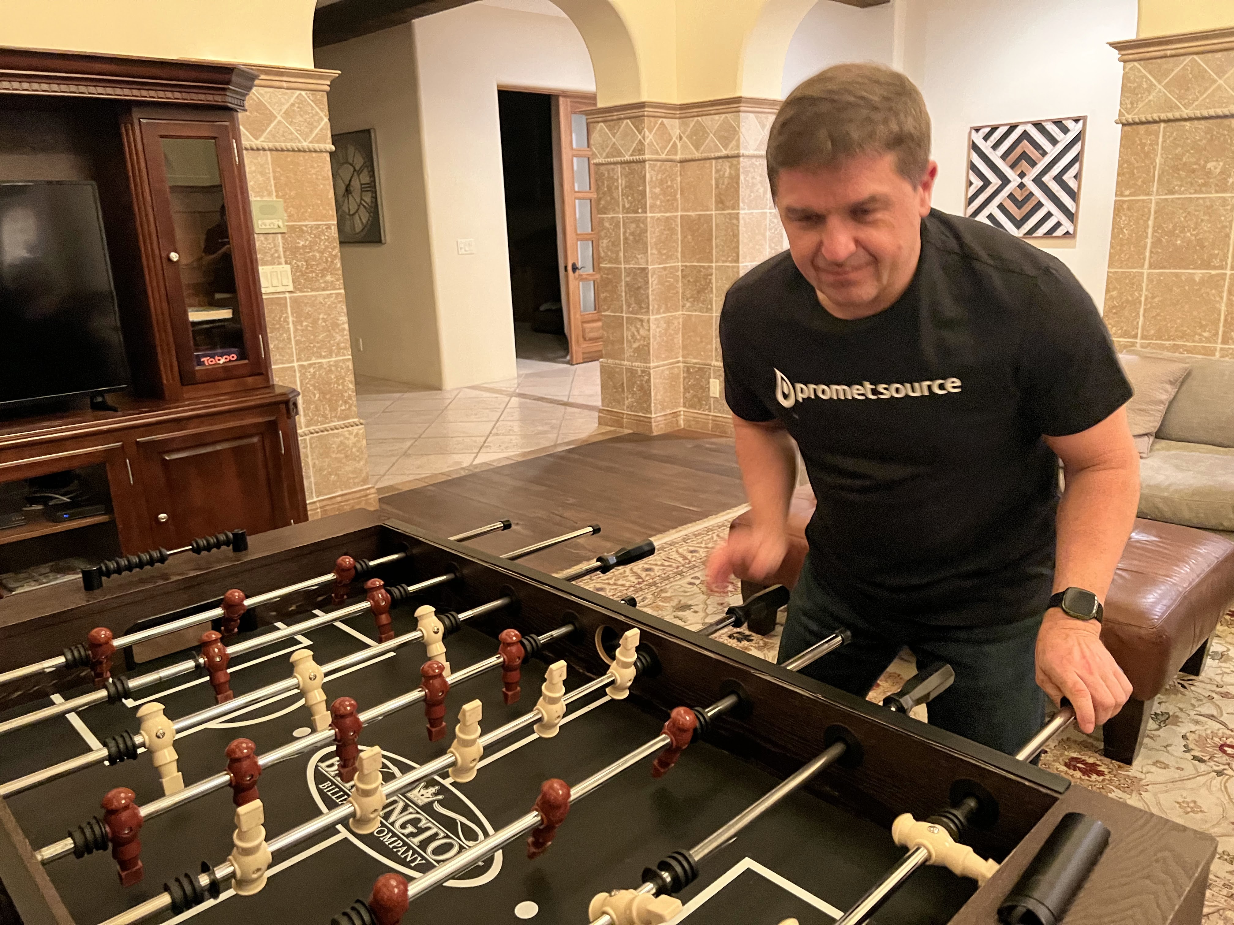 Andy playing foosball