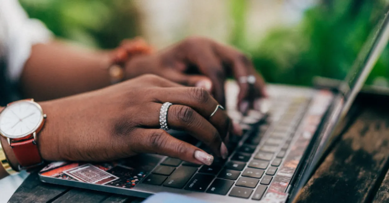 person typing on laptop