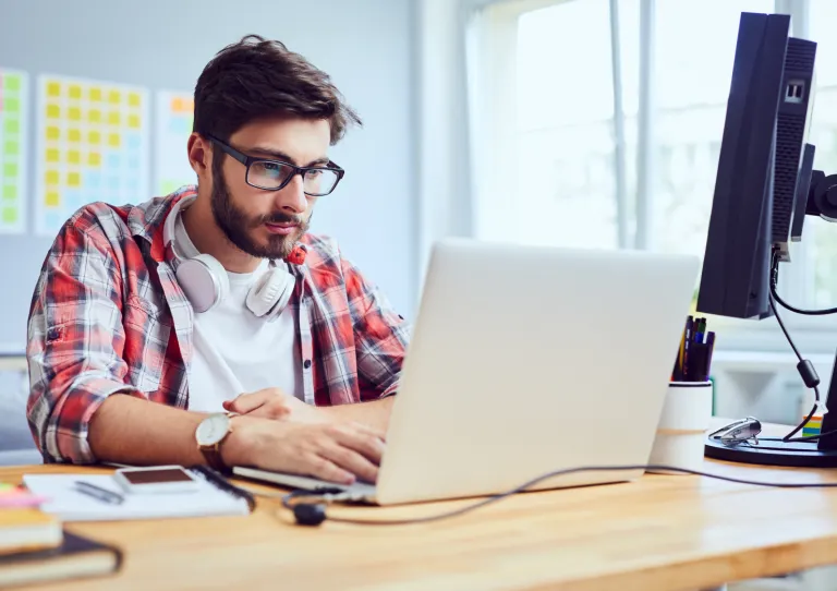 Person at laptop developing code