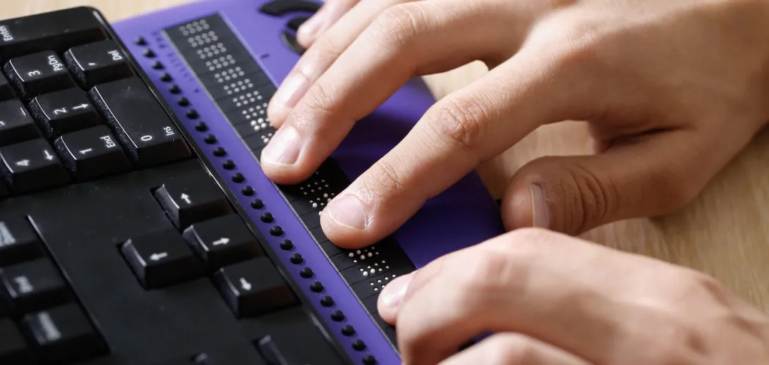 close up photo of person using assistive technology 