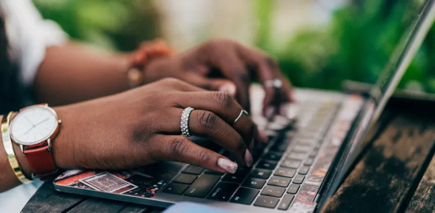 person typing on laptop